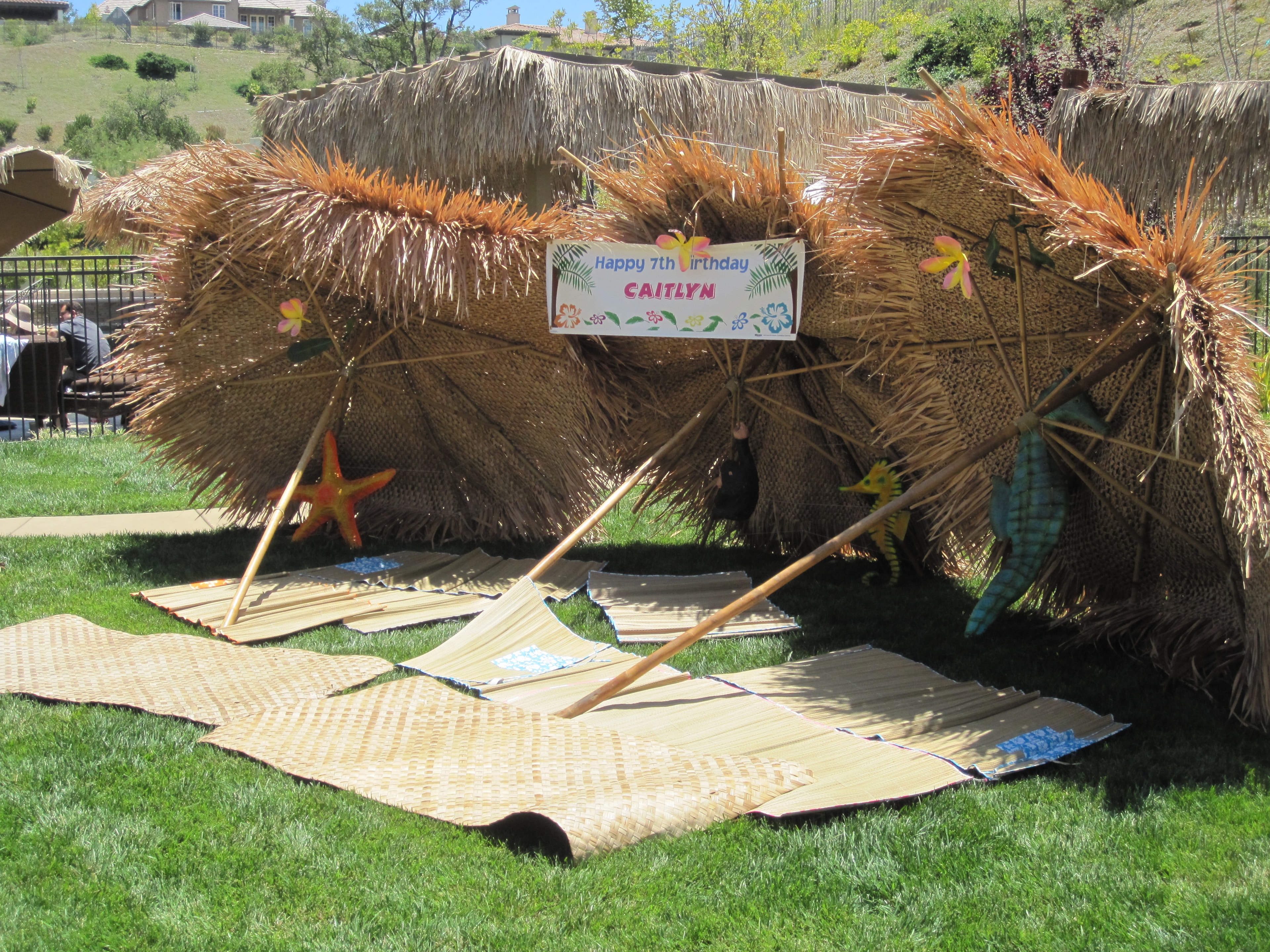 Backyard luau guests celebrating with Hawaiian entertainment in Henderson, NV
